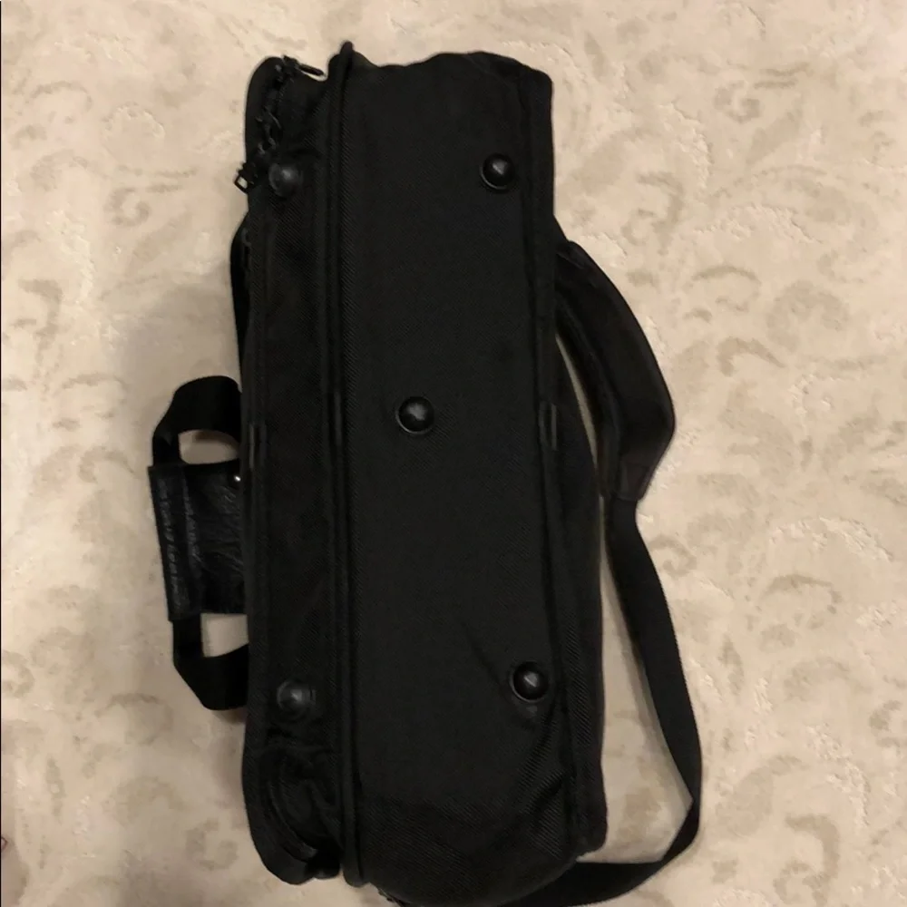 Tumi expandable crossbody suitcase/briefcase